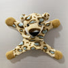 A plush toy resembling a leopard or cheetah, featuring light brown and blue spots, used as a fridge magnet.