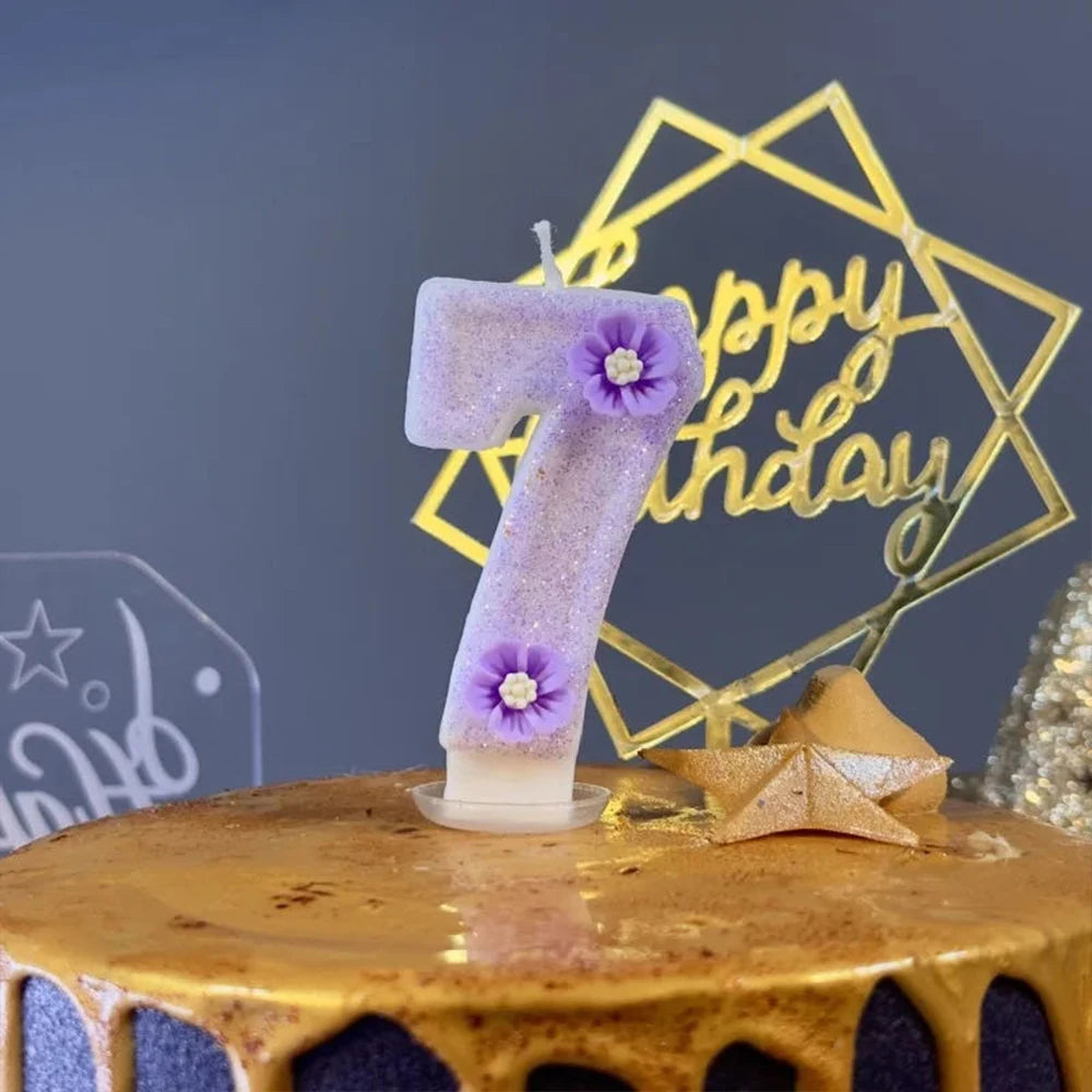 Purple sparkling number candles shaped like the number seven displayed on a golden geometric background.