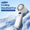 A white Kinscoter cooling handheld fan is shown resting on a snowy surface.