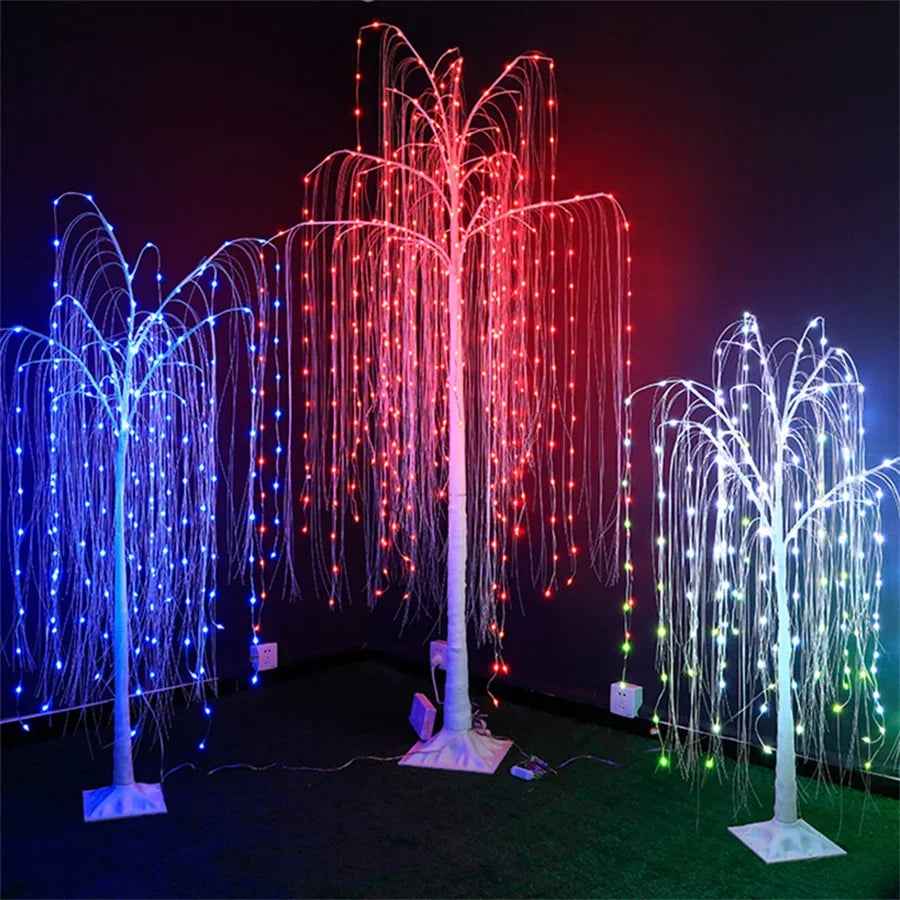 A weeping willow tree light display featuring numerous LED lights in blue, red, and white colors against a dark background.