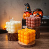 A display of silicone molds shaped like smiling pumpkins used for making candles and resin crafts.