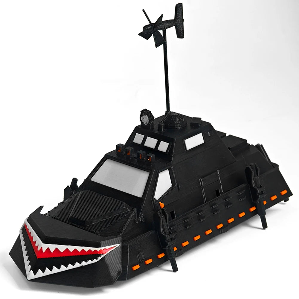A black 3D printed display model of a Tornado Intercept Vehicle featuring an antenna and aggressive front design.