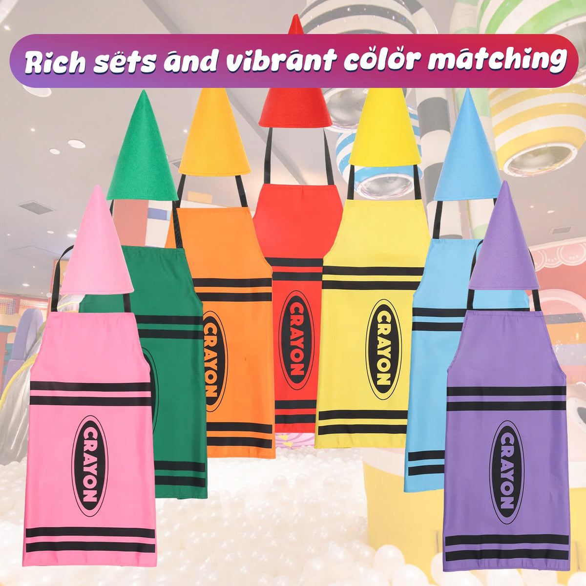 A set of seven brightly colored crayon apron and cone hat costumes displayed against a light background.