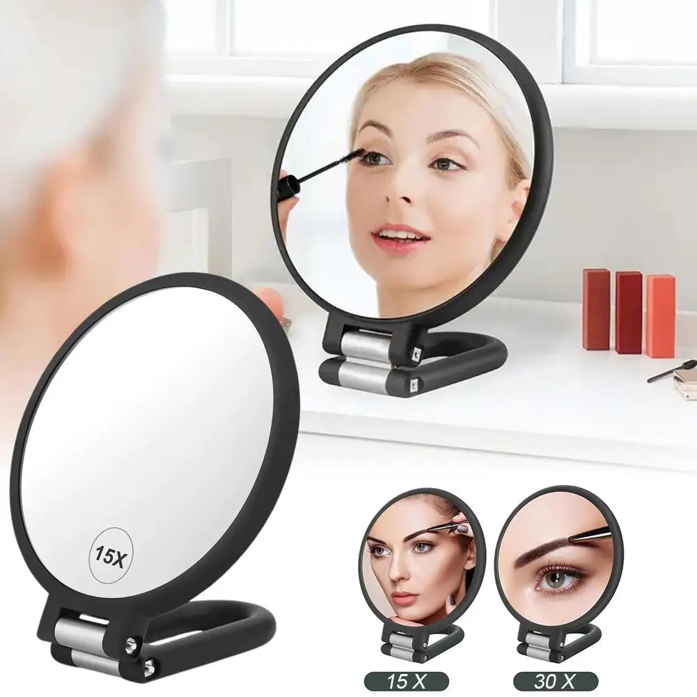 A set of precision dual-magnification handheld mirrors showing different magnification levels.