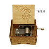 A wooden music box featuring a line drawing of an anime character, labeled 7-SJ1.