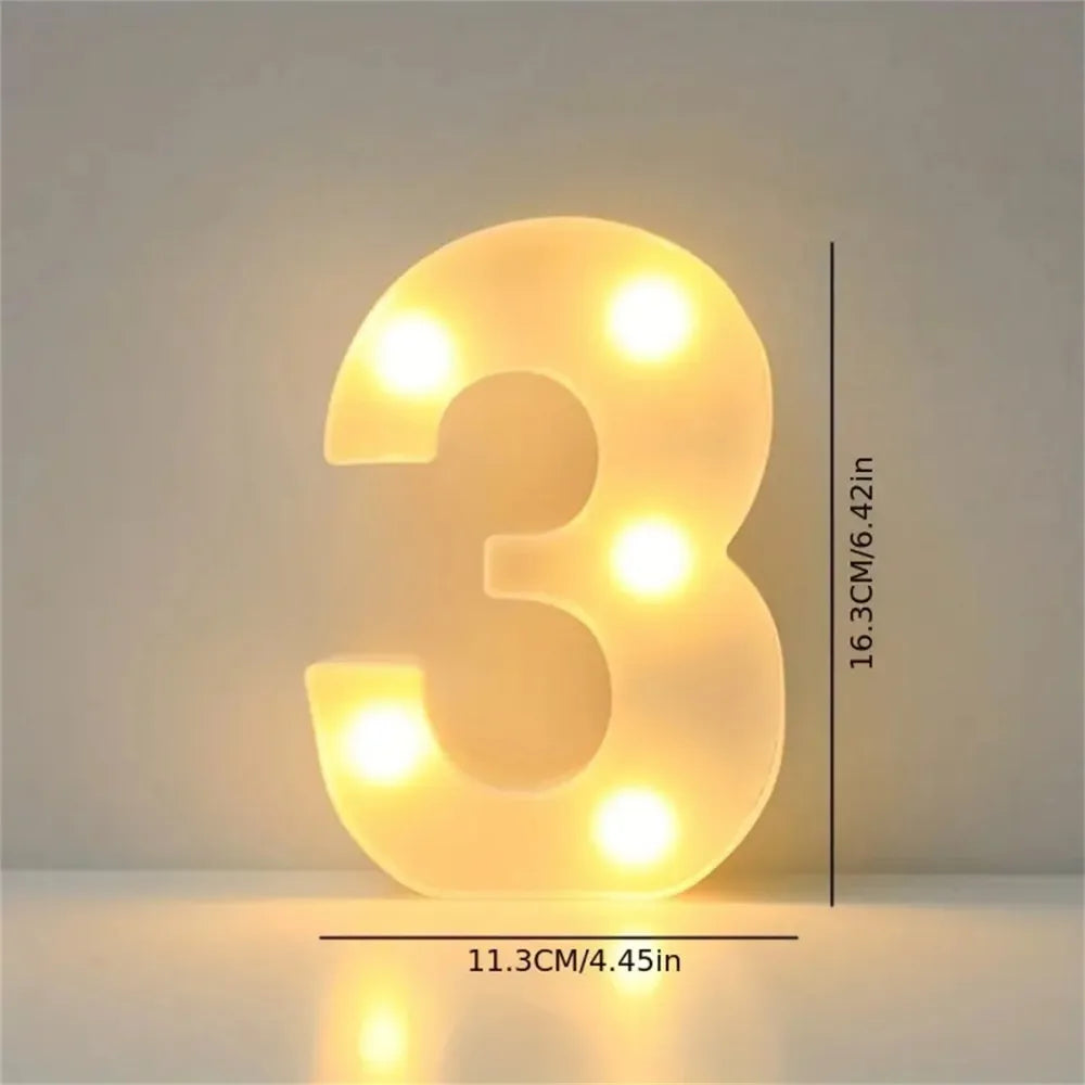 A glowing, three-dimensional number 3 made of LED letter lights, illuminating a room or party decor.