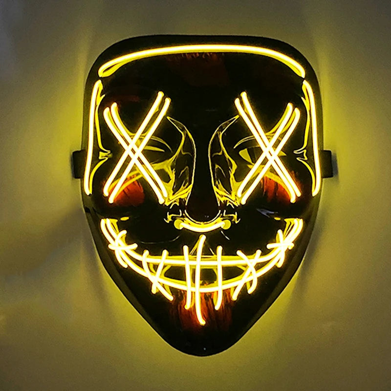 A glowing yellow LED mask shaped like a stylized skull with crossed eyes and a toothy grin.