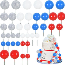 Un juego de toppers de pasteles de espuma de colores, incluyendo plata, blanco, azul y rojo.