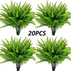A set of twenty artificial Boston ferns and faux shrubs used for home decor.