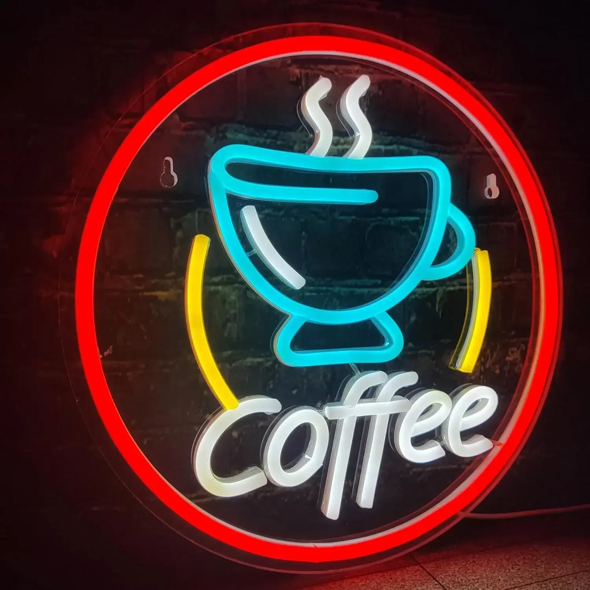 A neon sign featuring a stylized cup of coffee with steam and the word Coffee in white light against a dark background.