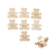 A set of wooden baby milestone cards featuring bear designs for months like five, six, four, three, two, and one.
