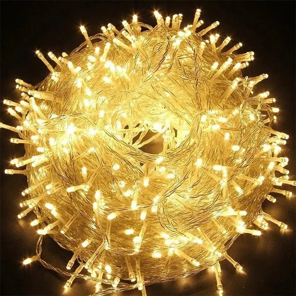 A tangled bundle of warm yellow LED fairy lights forming a spherical shape.