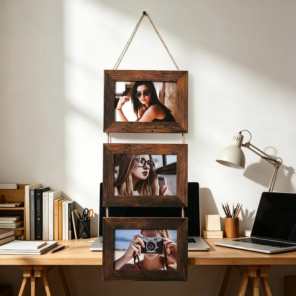 A set of three rustic wooden photo frames displayed vertically on a light-colored wall.