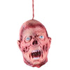 A realistic prop of a screaming, aged face with blue eyes and visible wounds, hanging by a string.