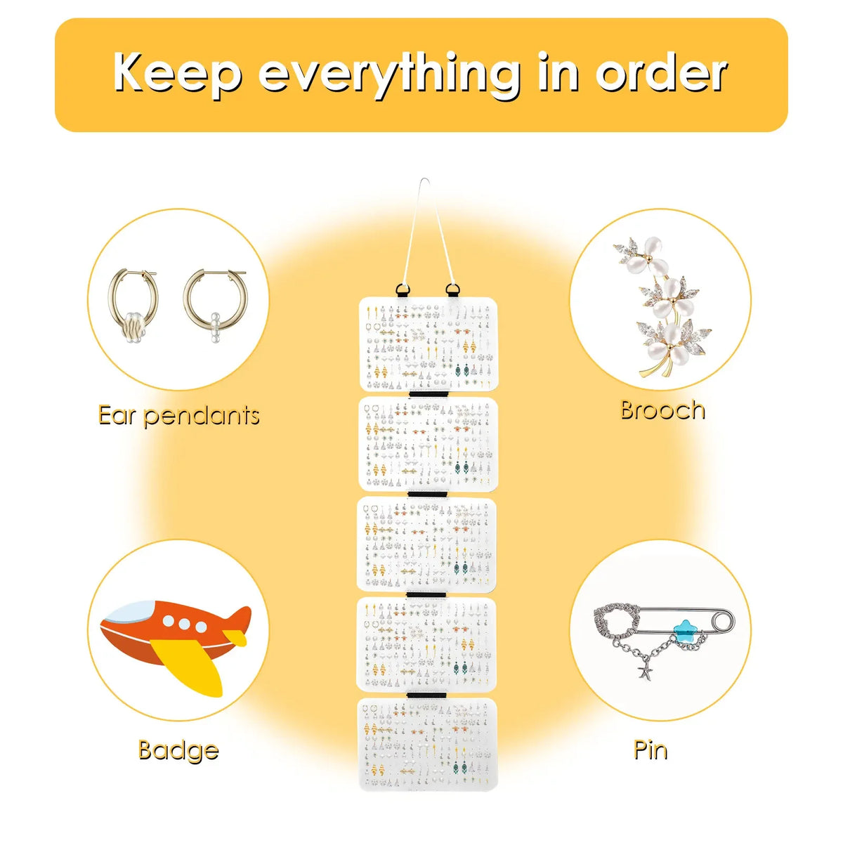 A display panel showing various hanging items including ear pendants, a brooch, a badge, and pins.
