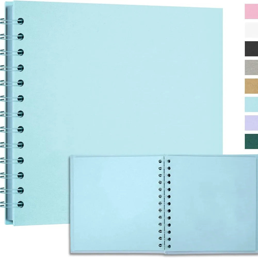 A light blue handmade kraft paper scrapbook with a spiral binding and a color palette swatch on the right.