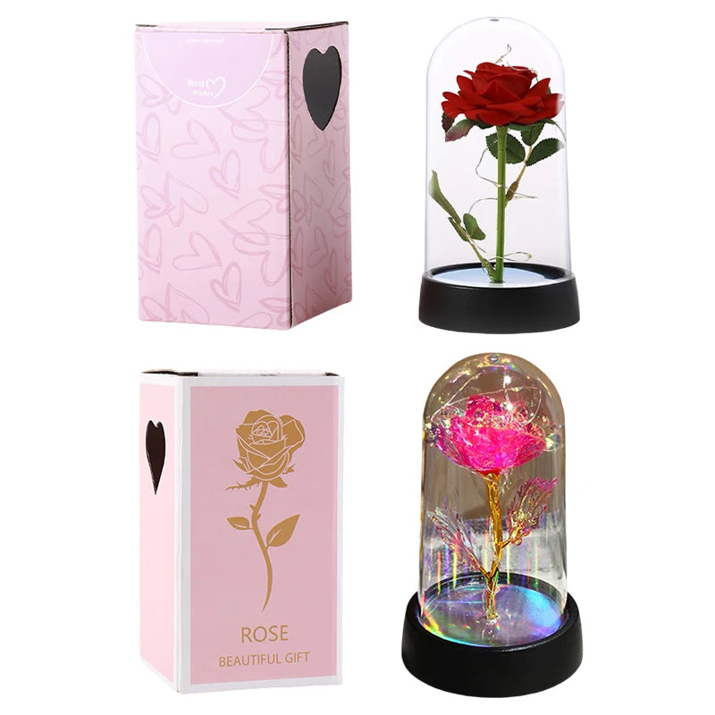 A pink rose in a glass dome with a black base, showcasing an eternal flower LED decorative item.