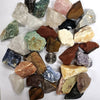 A collection of natural raw healing crystal stones in various colors and shapes.