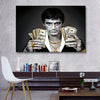 A canvas print featuring a dramatic portrait of a man with blood on his face, holding stacks of money.