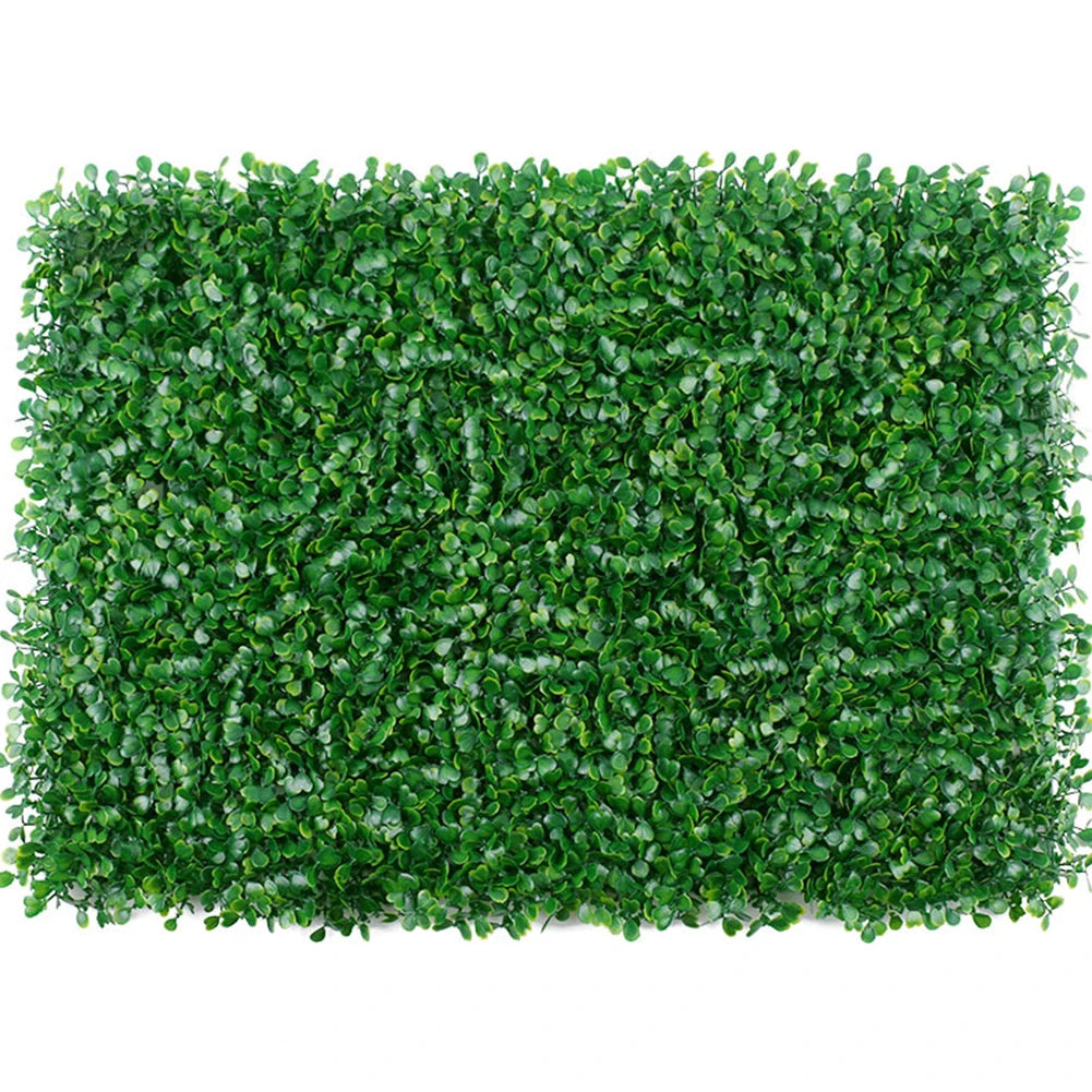 Dense green artificial grass hedge panels used for privacy and decoration