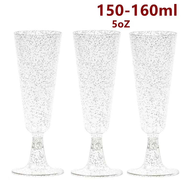 Three clear disposable plastic champagne flutes or party cups shown side by side.