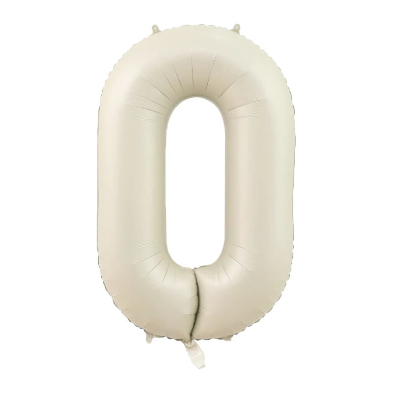 A beige foil number balloon shaped like the digit zero.