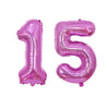 Two foil balloons shaped like the numbers 1 and 5 in rose gold for birthday party decor