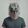 A person wearing a realistic werewolf full head mask with gray fur and visible teeth.