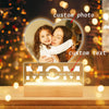 A personalized acrylic photo frame featuring a mother and child, with custom text engraved below.