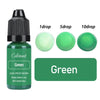 A bottle of green liquid colorant with dropper tips showing 1, 5, and 10 drops.