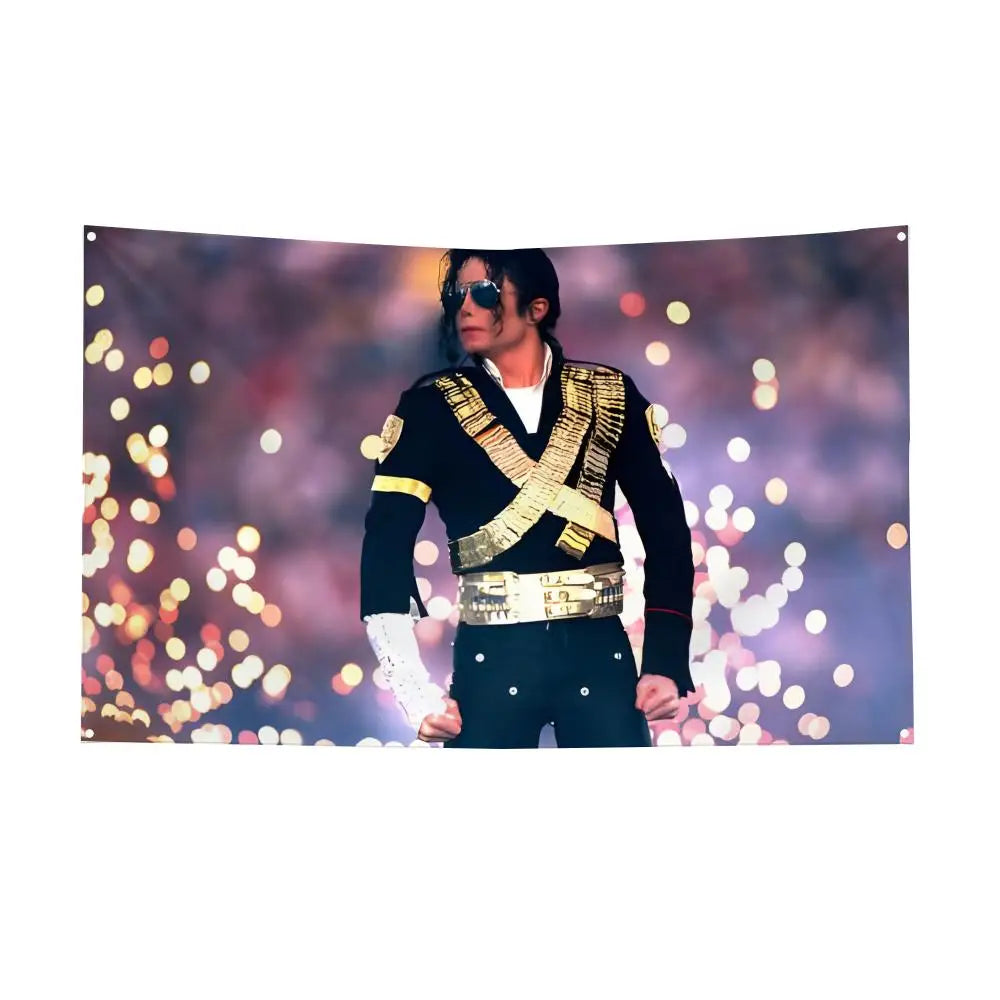 A man dressed in black with gold accents and sunglasses stands against a blurred, sparkling background.