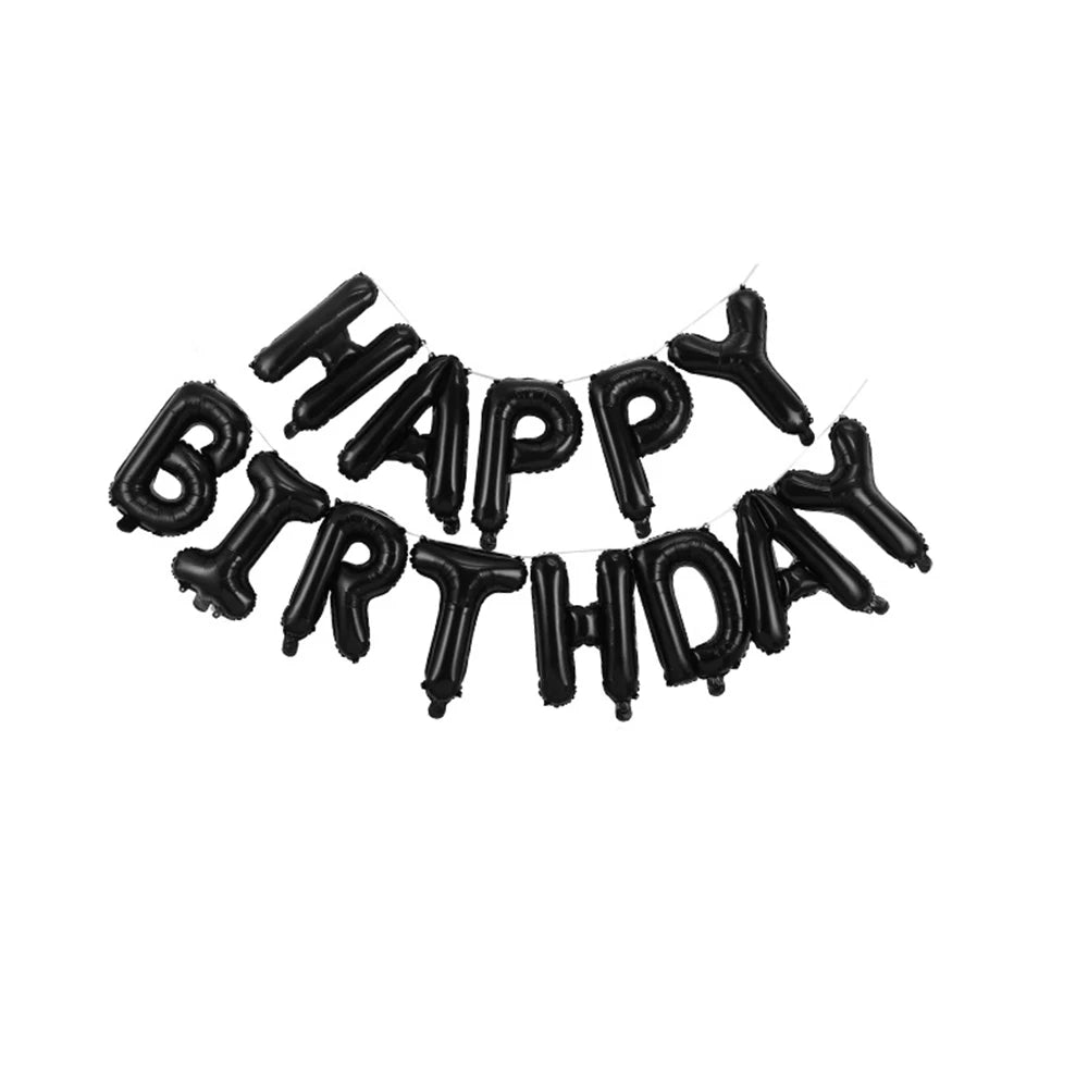 A string of black foil letter balloons spelling out Happy Birthday