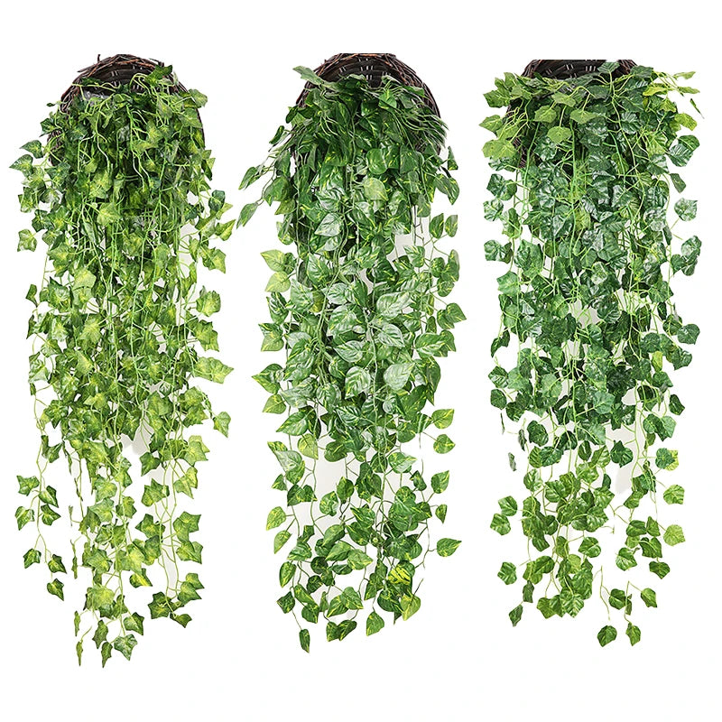 Three strands of artificial green plant vines hanging vertically