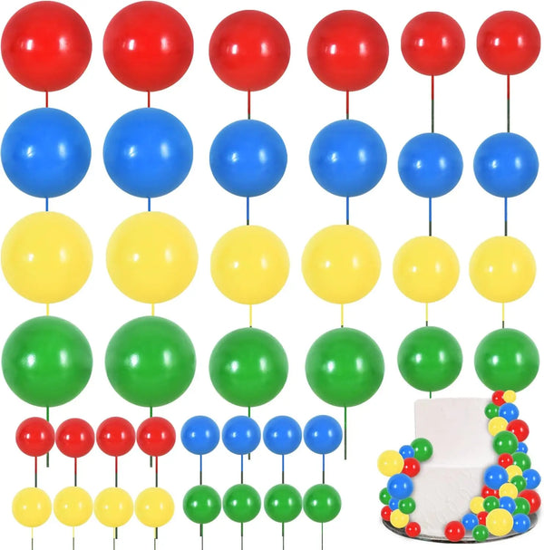 A set of colorful foam ball cake toppers in various colors including red, blue, yellow, and green.