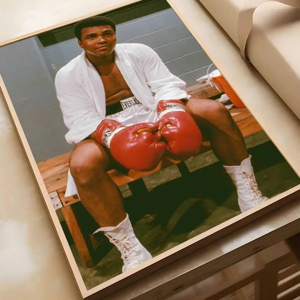 A portrait of a man in boxing attire sitting on a wooden bench, framed as wall art.