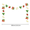 A decorative garland featuring strawberries, green leaves, and white flowers for a birthday party theme.