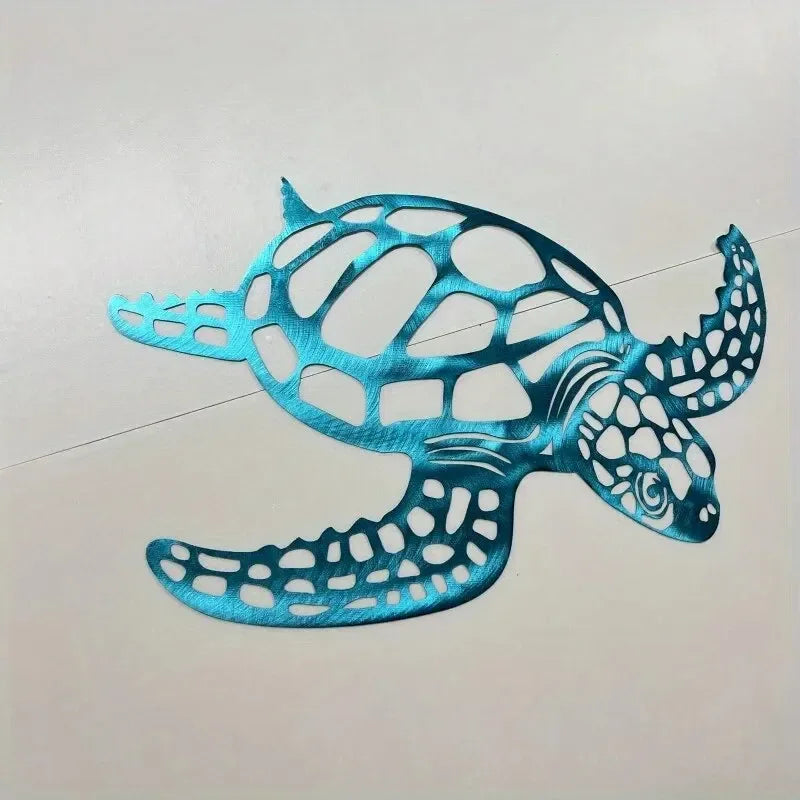 A teal metal sea turtle wall art sculpture with intricate cutout patterns against a white background.