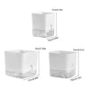 A white self-watering planter with a clear reservoir, shown in multiple views.