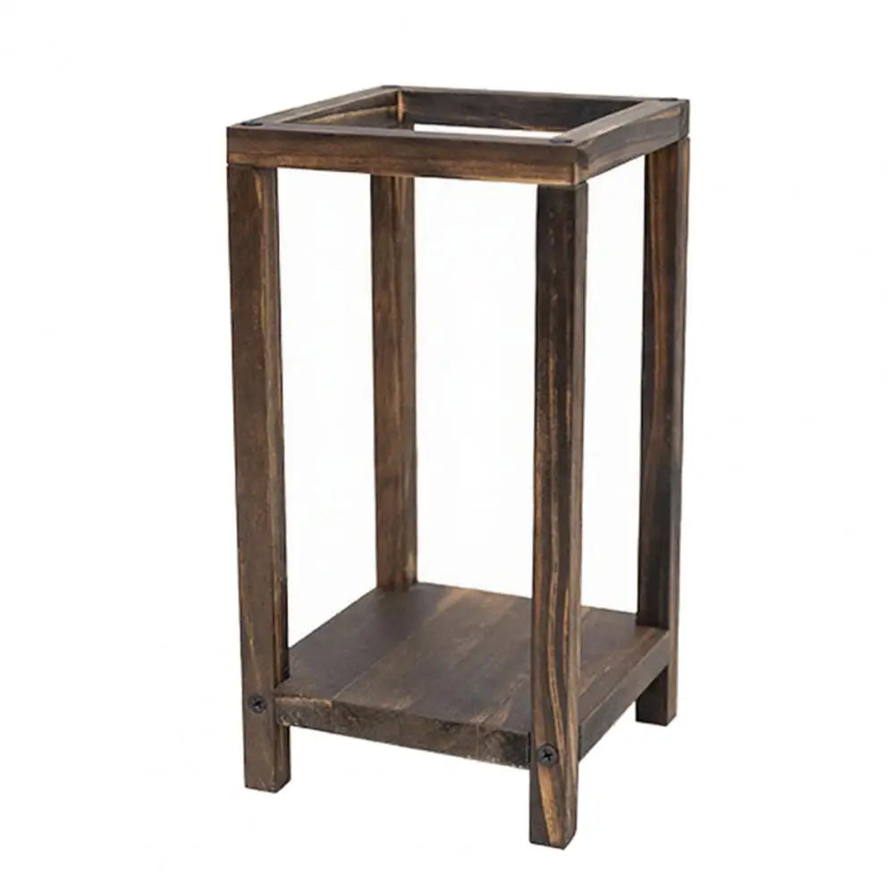 A rustic wooden candle holder lantern with a rectangular top and four vertical legs.