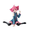 A pink-haired anime figurine of Hatsune Miku in a blue jacket and shorts.