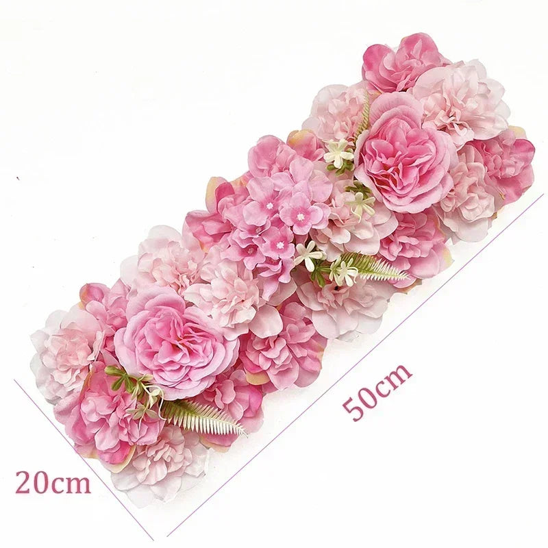 A long panel of pink artificial silk rose flowers used for weddings and events.