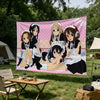 A large fabric tapestry featuring characters from the K-On! anime series in a pastel pink background.