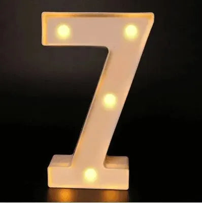 A luminous LED alphabet night light shaped like the number seven, glowing with warm white light.