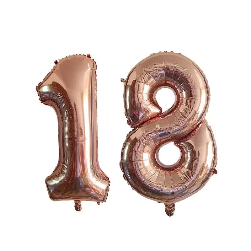 Two metallic rose gold foil number balloons, 1 and 8, for a birthday party.