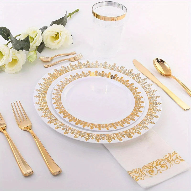 A set of gold disposable cutlery including forks, spoons, and knives displayed on a white plate and napkin.