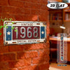 A vintage metal plaque with the year 1968 is mounted on a red brick wall.