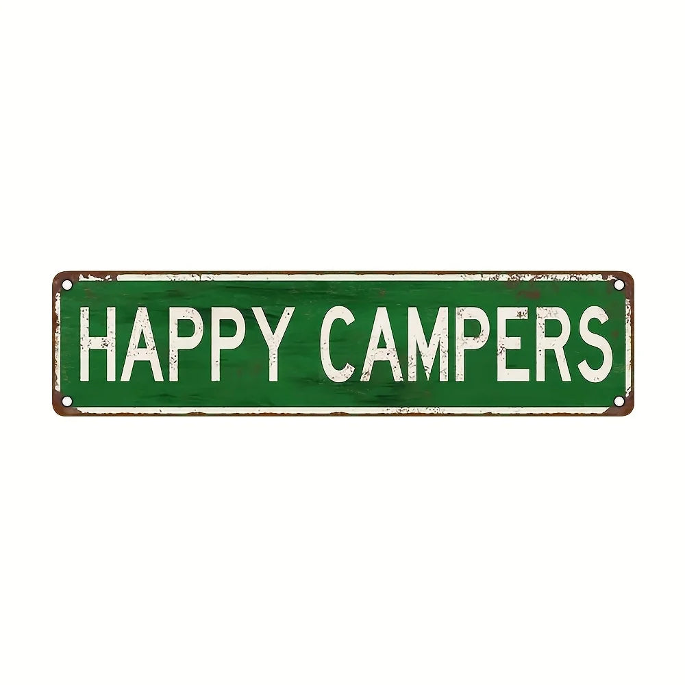 A weathered green metal sign with the text HAPPY CAMPERS in white capital letters.