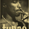 A close-up black and white portrait of Tupac with a piercing, intense gaze.