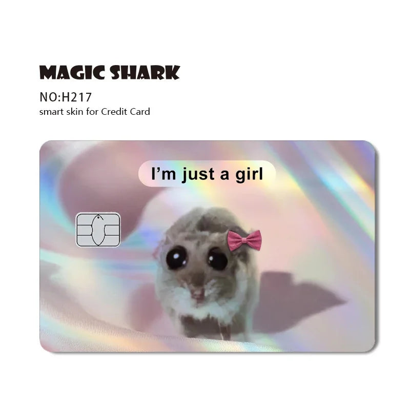 A holographic sticker featuring a cute, furry cat face with large eyes and a pink bow.