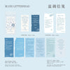 A set of blue letterhead paper featuring vintage old English manuscript designs and decorative elements.